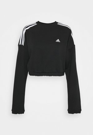 Czarna krótka bluza Adidas z długim rękawem, z trzema białymi paskami na ramionach i logo Adidas na piersi.