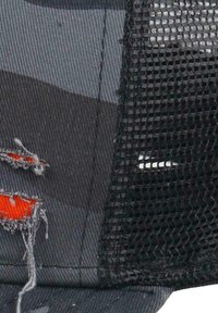 Baseball cap with a gray fabric front featuring a distressed orange detail, and mesh black back for ventilation.