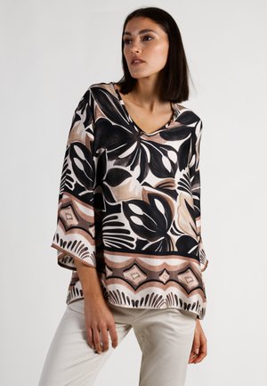 Langärmlige Bluse mit V-Ausschnitt aus leichtem Stoff, der ein Schwarz-Beige-Blumenmuster mit einer dekorativen Bordüre aufweist. Lockerer Schnitt.