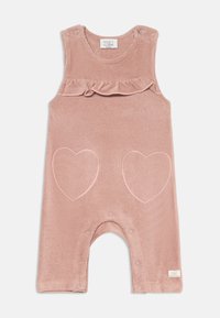 Rosa korduroy jumpsuit med volangaxlar, med två broderade hjärtformer på framsidan och tryckknappar i botten.