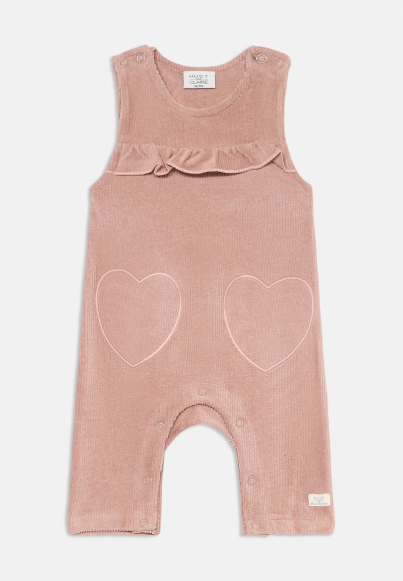 Rosa korduroy jumpsuit med volangaxlar, med två broderade hjärtformer på framsidan och tryckknappar i botten.