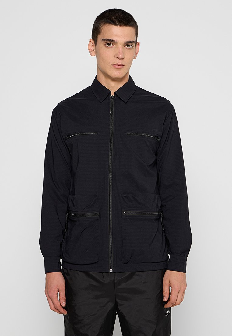 Rains Lichte jas zwart Rains Lichte jas zwart