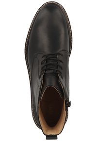 Musta nahkasaapas nilkkapituudella, pyöreällä kärjellä, nauhakiinnityksellä edessä ja vetoketjullisella sivulla. Vaaleanruskea sisustus ja kontrastivärinen ommel.