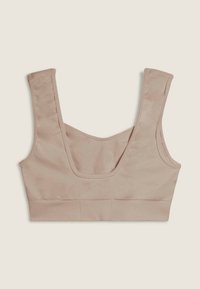 Top corto beige con spalline larghe, scollatura quadrata e dettagli delle cuciture su uno sfondo chiaro.