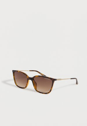 Tortoiseshell square sunglasses with brown gradient lenses and thin gold metal arms on a white background.