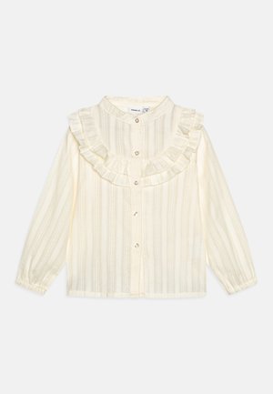 Blusa bianco-giallastra con colletto arricciato, chiusura anteriore con bottoni, maniche lunghe e una sottile trama a righe.