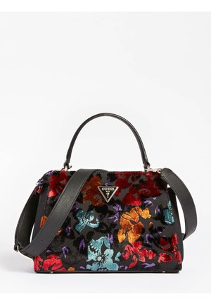 Sac à main noir avec motifs floraux en velours colorés, poignée et bandoulière en cuir noir, et un logo Guess triangulaire sur le devant.
