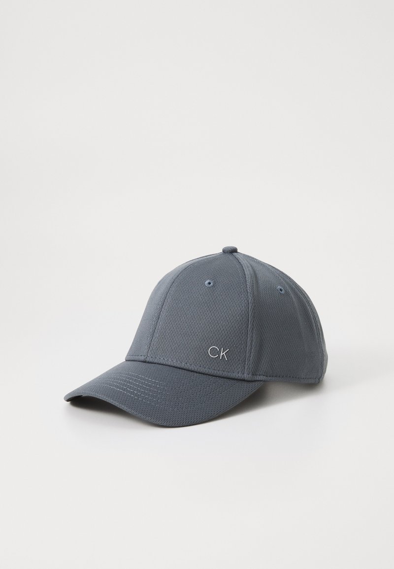 Gray baseball cap made of mesh fabric with a flat brim, featuring embroidered "CK" logo on the front and ventilation eyelets.