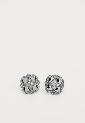 Silver-tone stud earrings with a floral design, featuring a central clear crystal and a border of small clear stones. Polished finish.