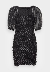 Svart klänning med genomskinliga puffärmar, rynkad textur och små blommiga dekorationer. Designad med fyrkantig halsringning och figurnära silhuett.