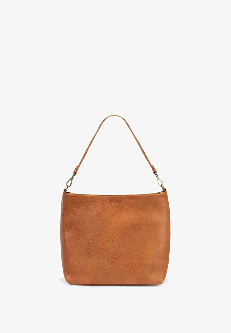 Tan leather handbag with a smooth texture, rectangular shape, and a single strap. Features a subtle logo on the front.