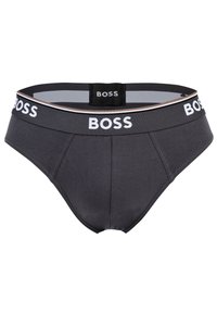 Boxer da uomo grigi realizzati in morbido tessuto, con una ampia cintura nera decorata con il logo bianco "BOSS" e strisce in beige e grigio.