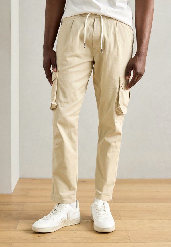 OVERDYED PANTS - Cargo trousers - stone