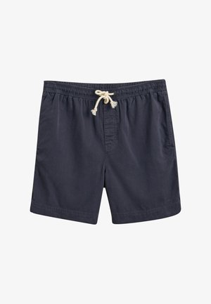 Bañador azul marino con cinturilla elástica y cordón crema, que presenta un único bolsillo frontal y una tela suave y texturizada.