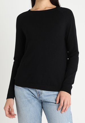 Maglione nero lavorato a maglia con scollo rotondo e maniche lunghe, caratterizzato da una vestibilità comoda e una texture a coste lungo l'orlo e i polsini.