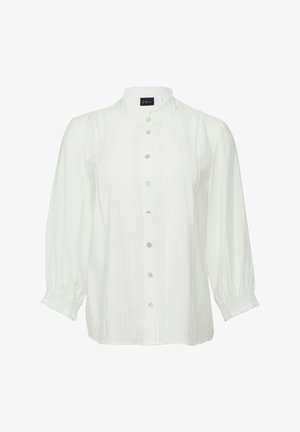 Biała bluzka z długimi, bufiastymi rękawami, stojącym kołnierzykiem i zapięciem na guziki. Posiada plisowania i subtelną fakturę.