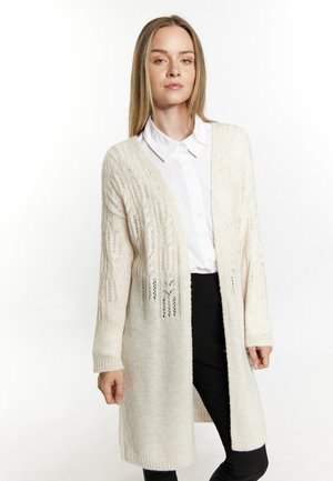 Langer, offener Cardigan aus cremefarbenem Strickstoff mit einem strukturierten Muster und Zopfmuster. Mit gerippten Bündchen und lockerer Passform.