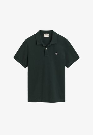 Sötétzöld pólóing, pamutból készült, klasszikus gallérral, rövid ujjakkal és egy kis hímzett logóval a bal mellrészen.