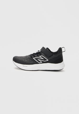 Black athletic shoe with a textured upper, white accents, and a strap across the laces. Features a cushioned sole for comfort.