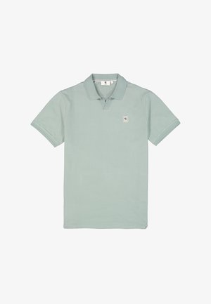 T-shirt polo en vert clair, en coton, avec un col classique, des manches courtes et une patch de logo sur la poitrine gauche.