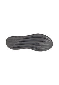 Semelle de chaussure en caoutchouc gris avec un motif texturé. Présente des rainures et des crêtes pour une meilleure adhérence. Les zones lisses et le design flexible améliorent la flexibilité.