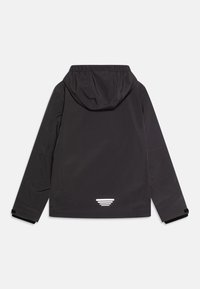 Black waterproof jacket with a hood, featuring a textured fabric, elastic cuffs, and a reflective logo detail at the back near the hem.