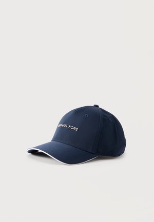 Tumesinine baseball-müts kaardus visoori, valge äärisega ja ees keskel tikitud "Michael Kors" logoga.