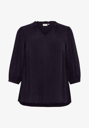Bluză de un mov închis cu decolteu în V și guler volan. Are mâneci puff până la trei sferturi și o croială lejeră. Textură netedă, detalii minime.