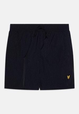 Navy swim shorts made of lightweight fabric. Features an elastic waistband with drawstring, two side pockets, and a small yellow logo.
