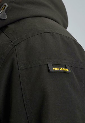 Black outerwear featuring a textured finish, a hood, and a visible "PME LEGEND" label in yellow. Stitching details accent the design.
