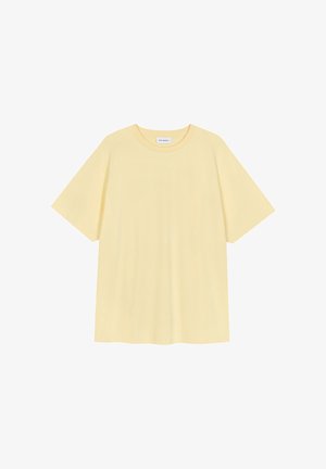 T-shirt jaune clair uni à manches courtes et col rond, coupe décontractée, présenté sur fond blanc.