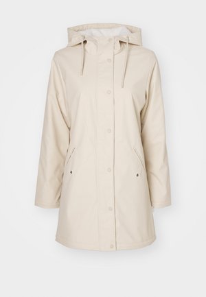 Imperméable beige avec capuche, boutons-pression et poches latérales. Fabriqué en matériau lisse et imperméable. Doté d'une doublure douce.