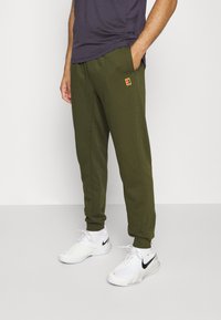 Nike Performance HERITAGE PANT - Calças de fato de treino - rough green