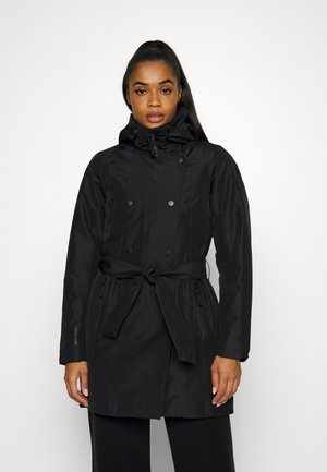 Black waterproof jacket with a double-breasted design, adjustable hood, tied waist, and zippered pockets. Smooth texture and lightweight.