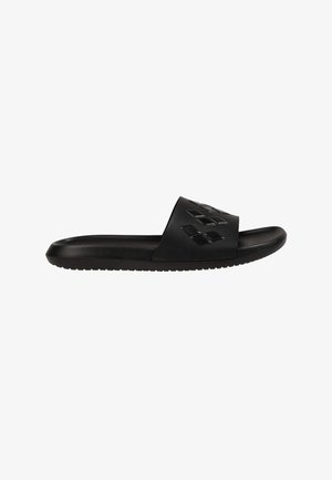 Black slide sandal with textured sole and wide strap featuring embossed diamond-shaped patterns.