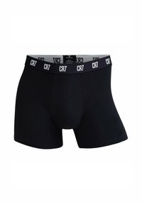 Boxer neri con una vestibilità aderente, realizzati in cotone. Presentano un ampio cinturino elastico con logo "CR7" ripetuto in bianco. Dettaglio di cucitura frontale.