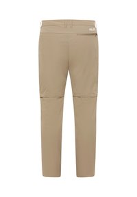 Pantalon convertible beige pour l'extérieur avec jambes amovibles grâce à une fermeture éclair, poche zippée à l'arrière, passants pour ceinture et petit logo Jack Wolfskin sur la ceinture.
