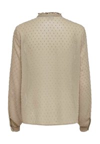 Langärmlige beige Bluse mit strukturiertem Punkte-Muster, Rüschenausschnitt und geknöpften Manschetten. Leichter, halb transparenter Stoff.