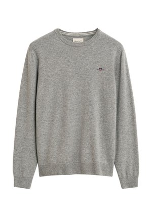 Maglione grigio chiaro realizzato in morbido tessuto a maglia. Presenta un colletto a girocollo, polsini e orlo a costine, e un piccolo logo sul petto. Vestibilità standard.