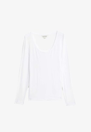 Camiseta blanca de manga larga en tejido suave, con escote redondeado y un corte relajado. Textura lisa sin patrones ni acentos visibles.