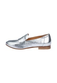 Silver metallic loafer with a smooth texture, rounded toe, and minimal stitching. Features a low stacked heel and soft interior lining.