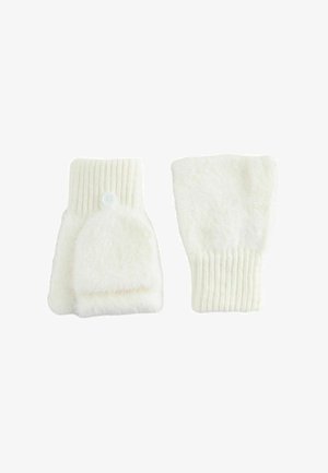 Une paire de mitaines blanches en tricot avec un rabat à bouton permettant de les transformer en gants ou en style sans doigts.