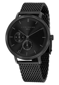 Schwarze analoge Uhr mit einem Mesh-Armband. Runde Gehäuse, minimalistisches Design, zwei Zifferblätter für die 24-Stunden-Anzeige und das Datum. Glatte, strukturierte Oberfläche.