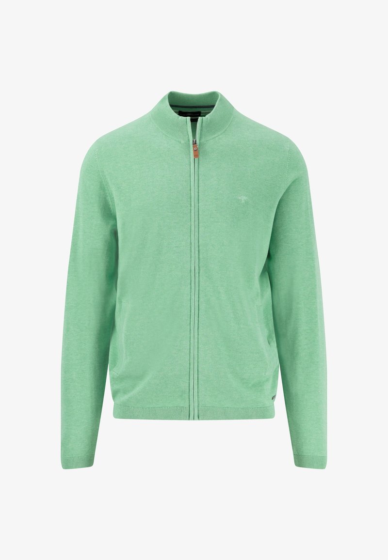 Világos zöld, cipzáras kardigán, puha kötött anyagból készült. Magas gallérral, bordázott mandzsettával és hemmel rendelkezik, a mellkason egy kis logóval.