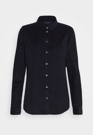 Chemise noire à manches longues avec col et poignets boutonnés, présentée sur fond blanc.