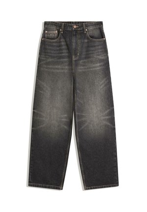 Černé džínové kalhoty širokých nohavic s vybledlou texturou, pěti kapsami, měděným kováním a žlutým prošíváním po celém povrchu.