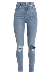 Vaaleansiniset korkeavyötäröiset skinny-farkut, joissa on kuluneet repeämät molemmissa polvissa ja klassinen viiden taskun tyyli.