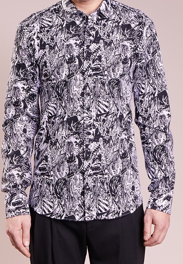 Long-sleeve shirt made from lightweight fabric featuring a black and white abstract pattern. Equipped with a classic collar and button front.