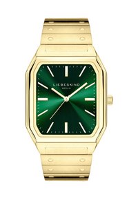 Orologio ottagonale in oro con un quadrante a raggio di sole verde scuro, indicatori delle ore in argento e un bracciale in oro abbinato caratterizzato da puntini in rilievo per una texture aggiuntiva.