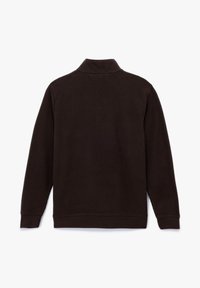Brauner, gerippter Pullover mit hohem Kragen und langen Ärmeln. Hat eine einfarbige Ausführung ohne Muster und ist aus einem weichen Material gefertigt.